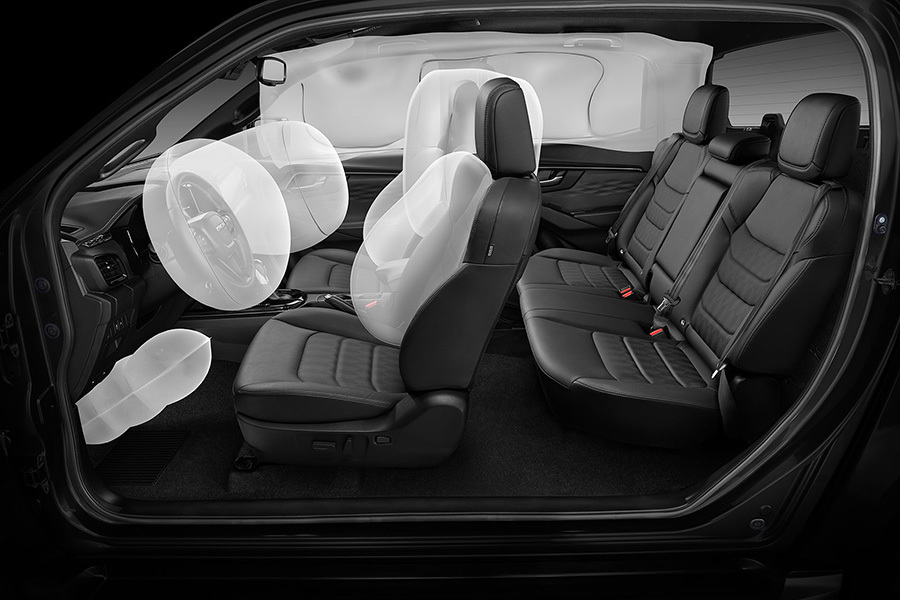 Illustration av Isuzu D-Max med utlösta krockkuddar – visar placering och omfattning av fordonets krockskyddssystem.